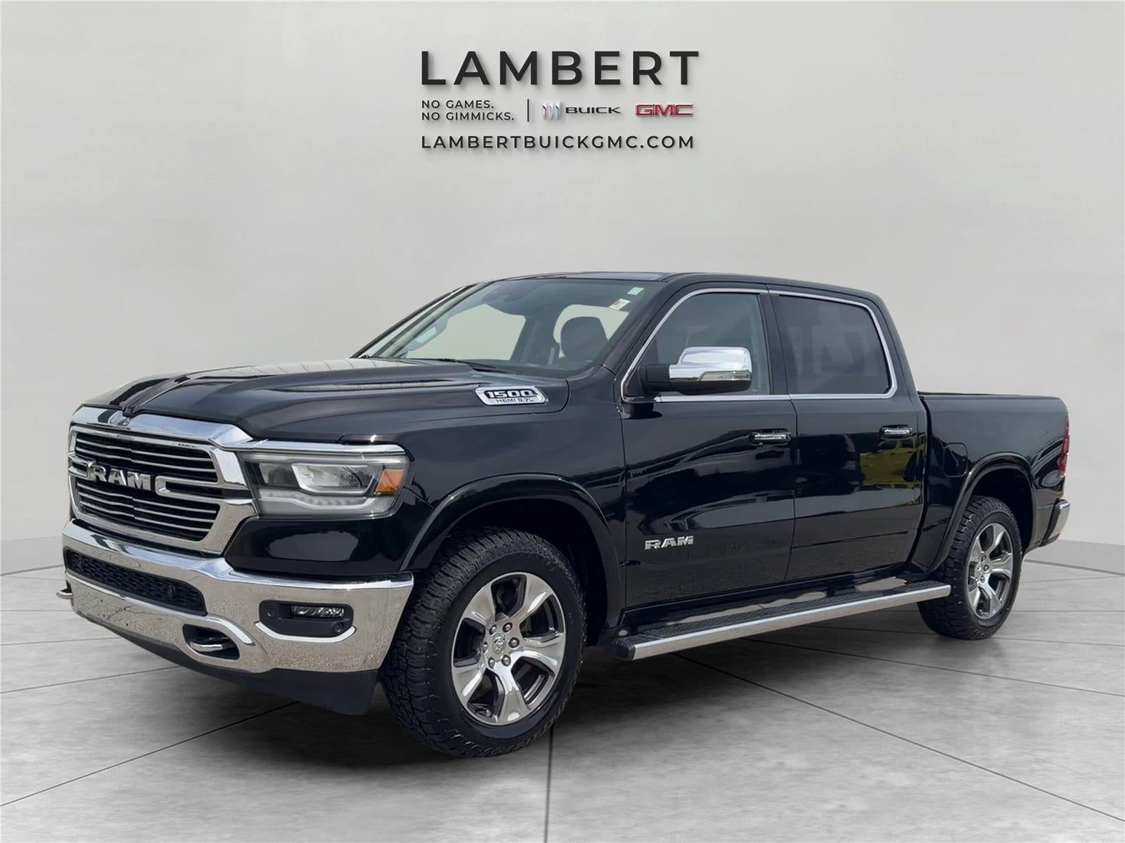 2022 RAM 1500 Laramie in Diamond Black Cry — front three-quarter view