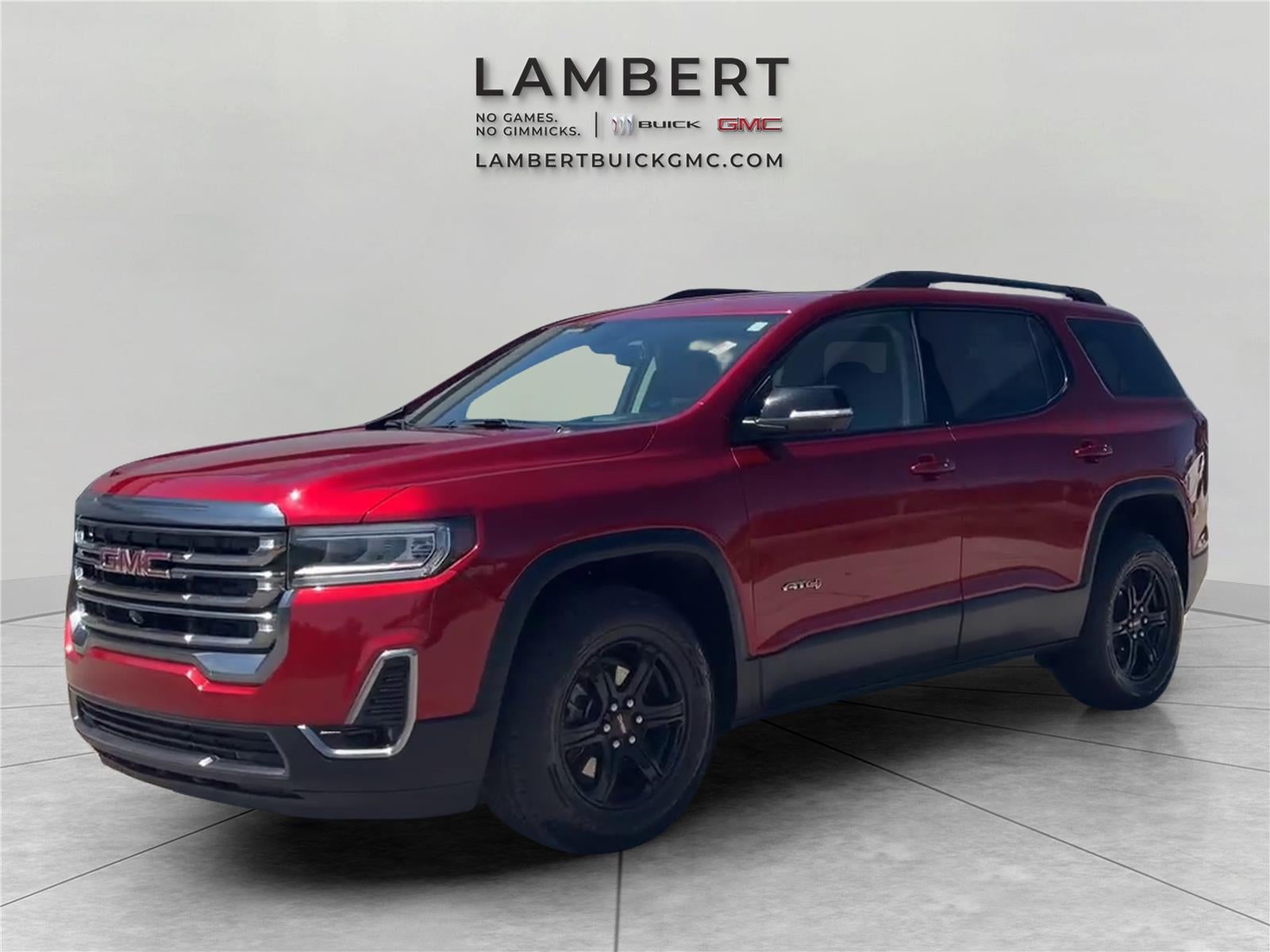 2023 GMC Acadia AT4 in Volcanic Red Tintcoat — front three-quarter view