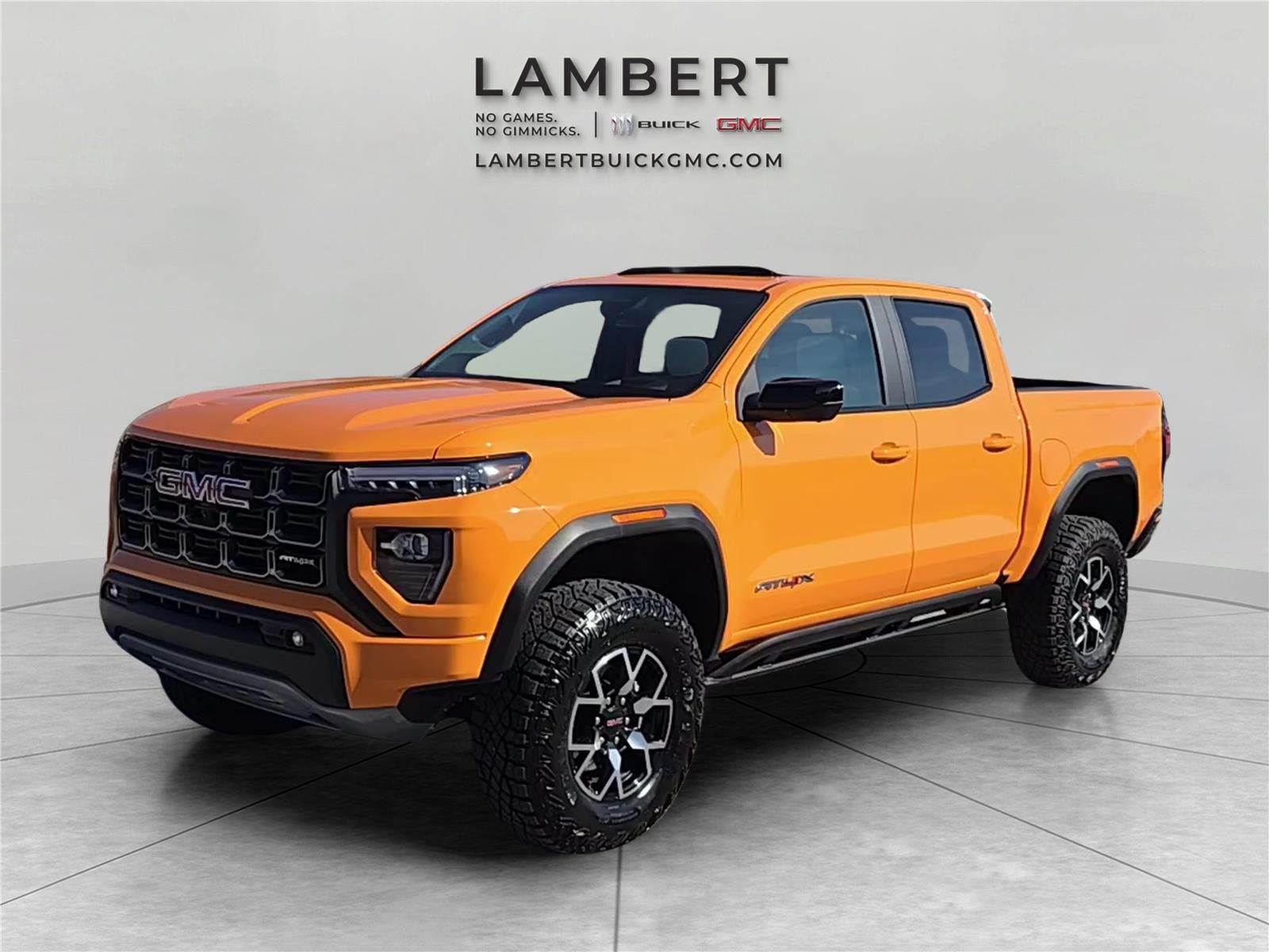 2026 GMC Canyon AT4X in Desert Sun — front three-quarter view