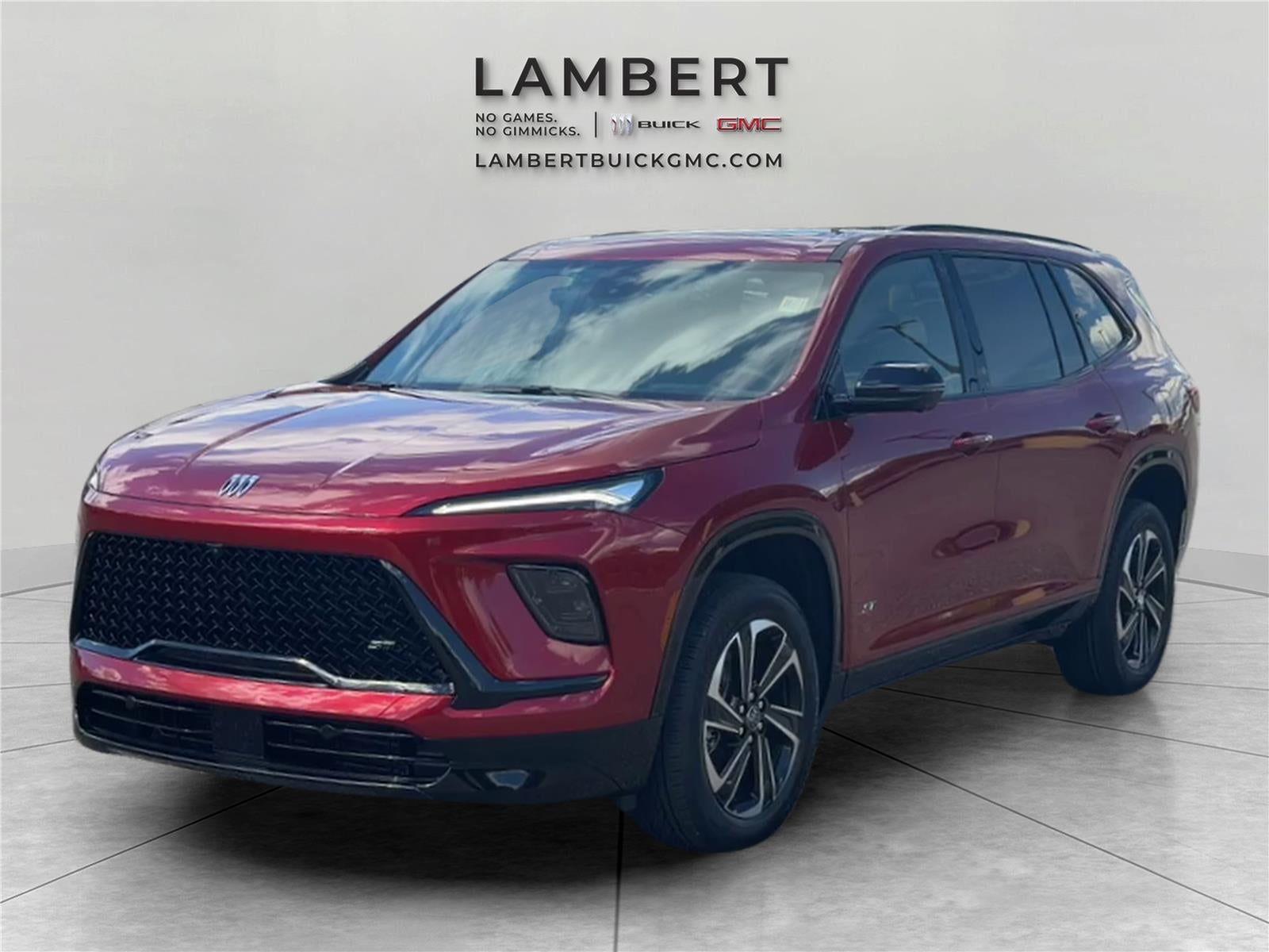 2026 Buick Enclave Sport Touring in Cherry Red Tintcoat — front three-quarter view