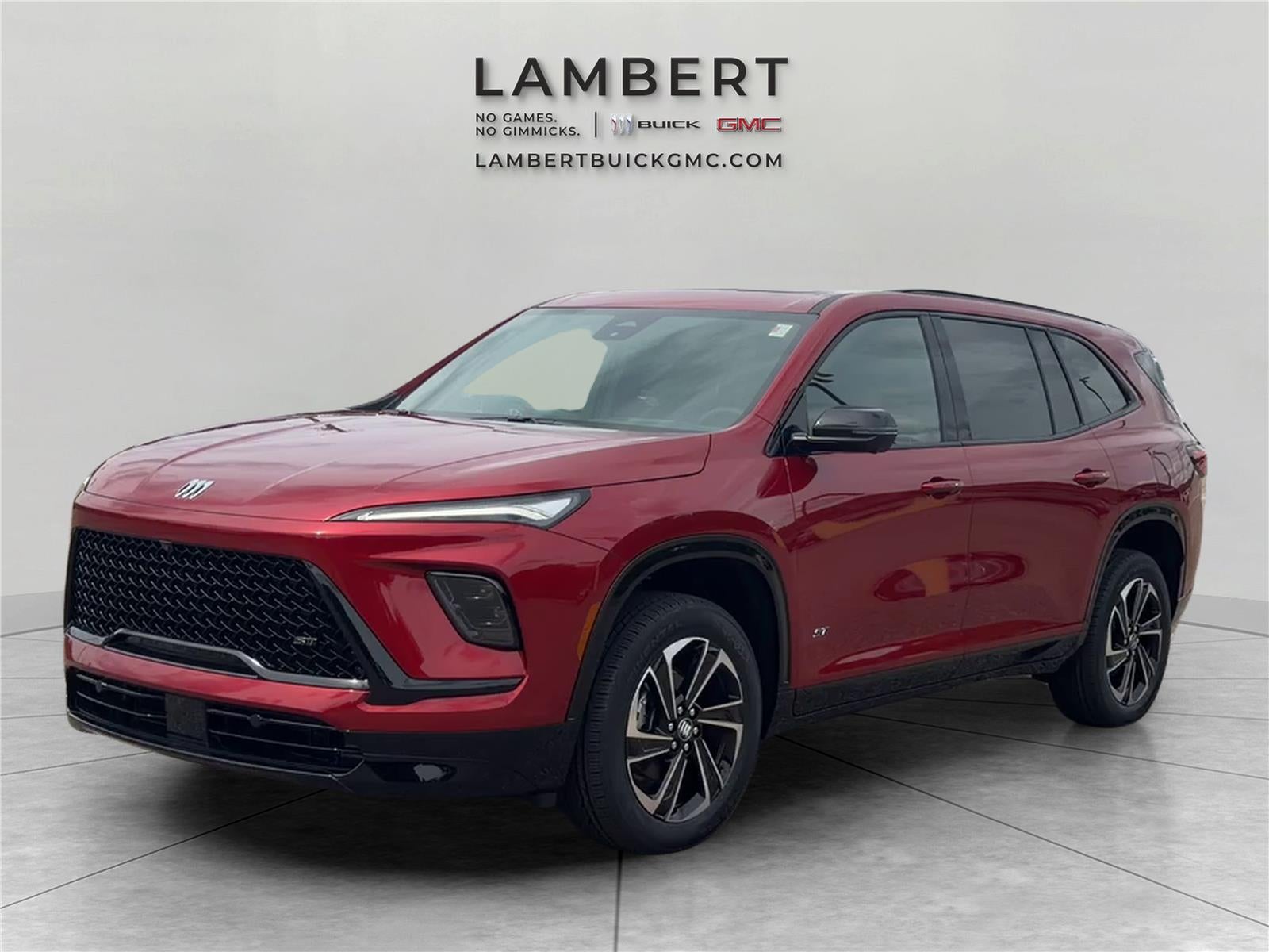 2026 Buick Enclave Sport Touring in Cherry Red Tintcoat — front three-quarter view