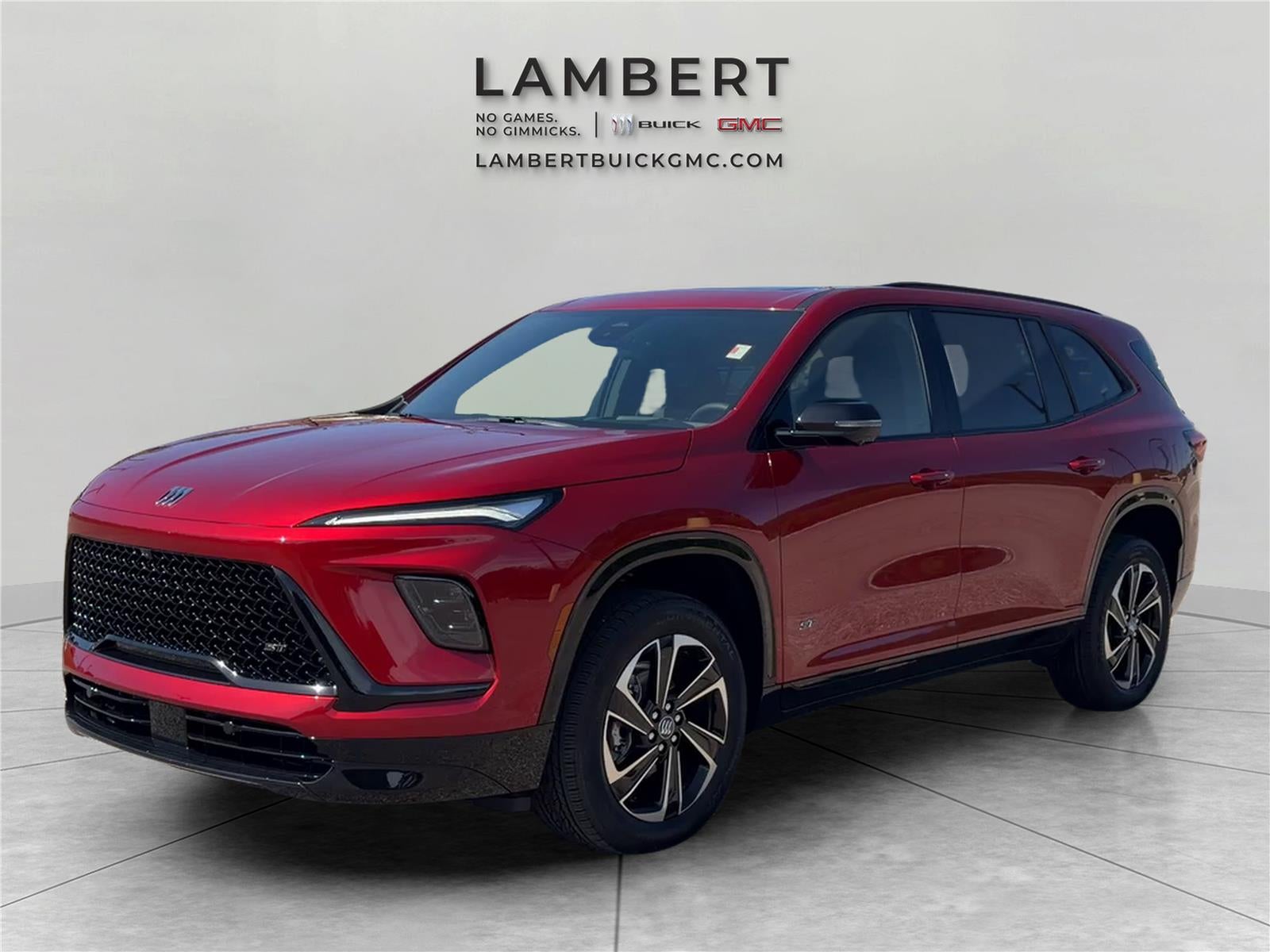 2026 Buick Enclave Sport Touring in Cherry Red Tintcoat — front three-quarter view