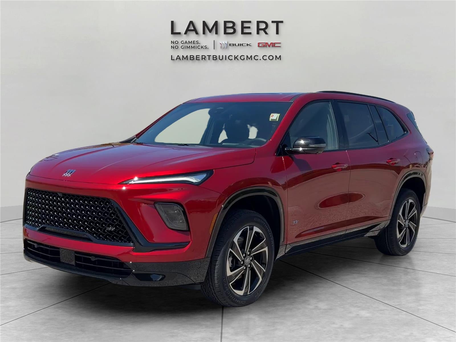 2026 Buick Enclave Sport Touring in Cherry Red Tintcoat — front three-quarter view